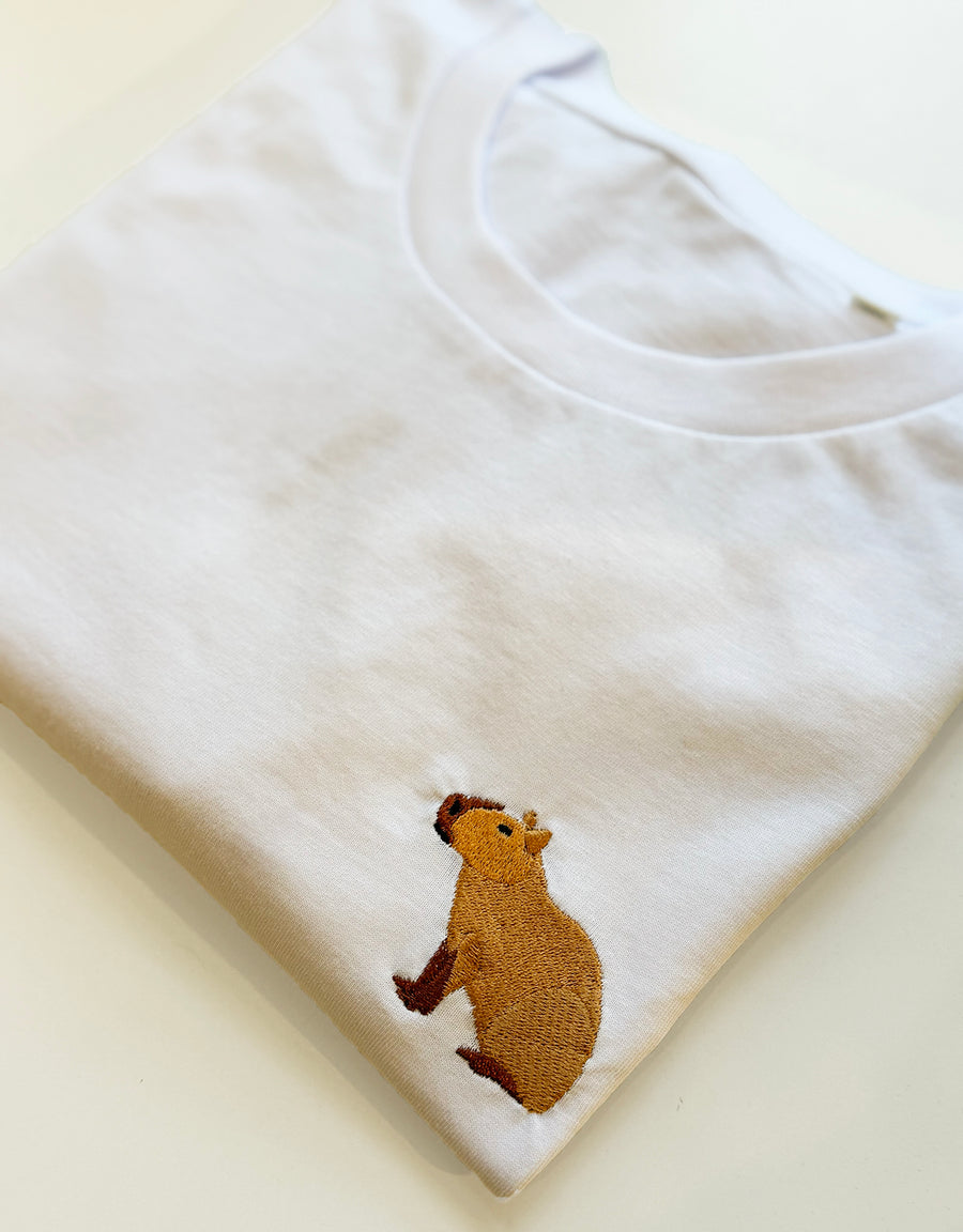 Close-up of the capybara embroidery on an organic cotton t-shirt