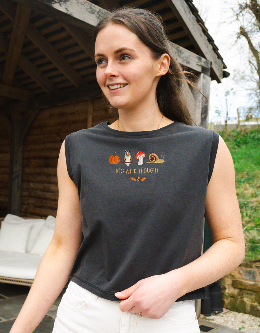 Cosy Autumn embroidered unisex sleeveless tee in Washed Black, with a pumpkin, owl, toadstool and snail design