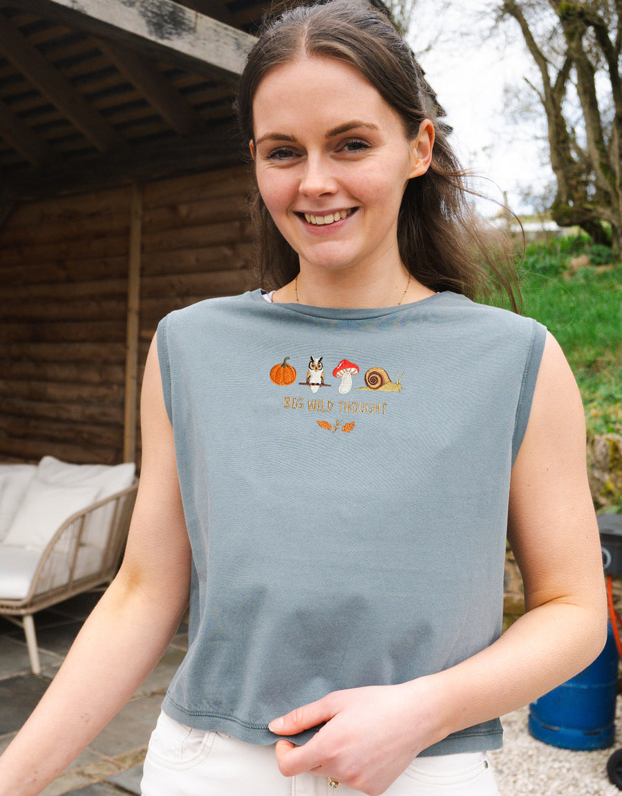 Cosy Autumn embroidered unisex sleeveless tee in Washed Blue, with a pumpkin, owl, toadstool and snail design